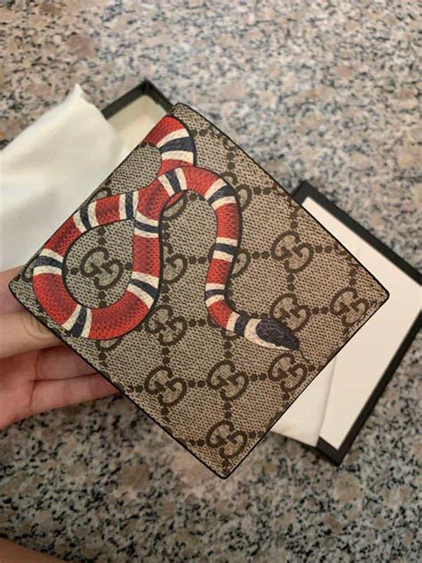 fake gucci snake keychain|gucci counterfeit wallet.